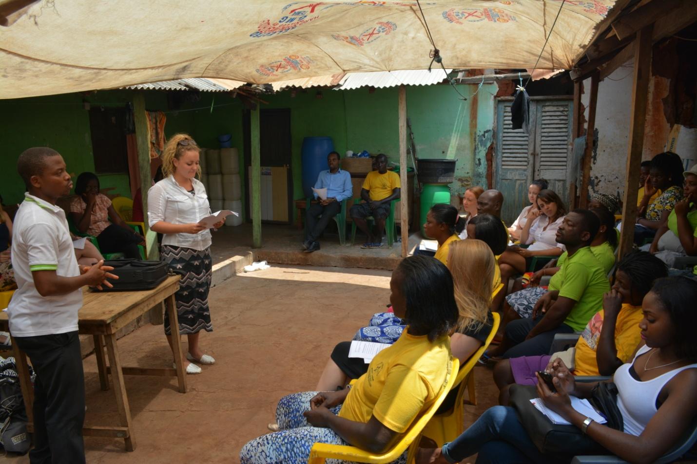 Interns speak to a group of community members on police brutality for their Human Rights work in Ghana. Projects Abroad representatives address a community on police brutality on their Human Rights internships in Ghana.